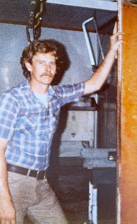 Young Howard Walker at the shop